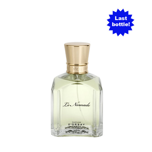 Frasco de Le Nomade Eau de Parfum D’Orsay Parfums de 50 ml, vidrio transparente y tapón dorado