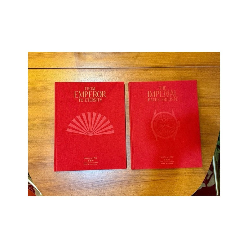 Catálogo rojo The Imperial Patek Philippe junto a From Emperor to Eternity de Phillips
