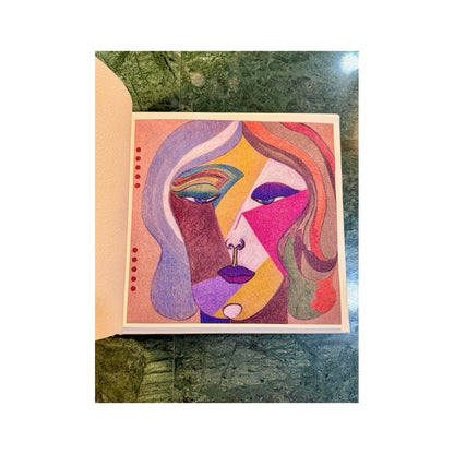 Retrato cubista de colores en una página abierta del libro de artista de Rosa Yagüe Martín