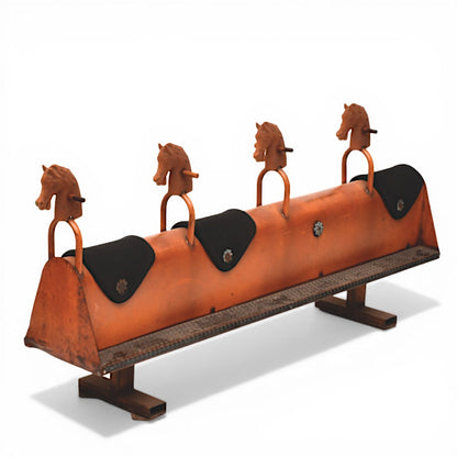 La Basilica Galeria antique industrial four-seat horse rocker with orange patina, black seats, and cast iron horse heads.
