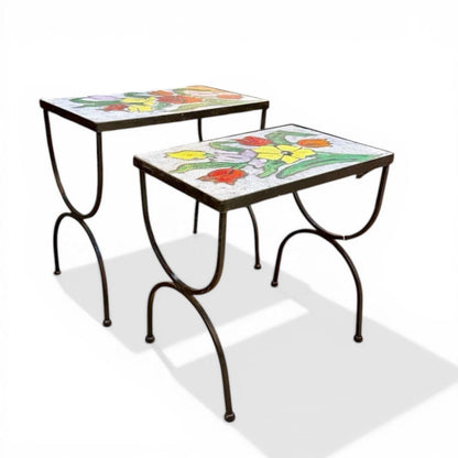 La Basilica Galeria French style accent tables with hand-enameled ceramic floral tops and dark metal frames. Mid-century modern design.