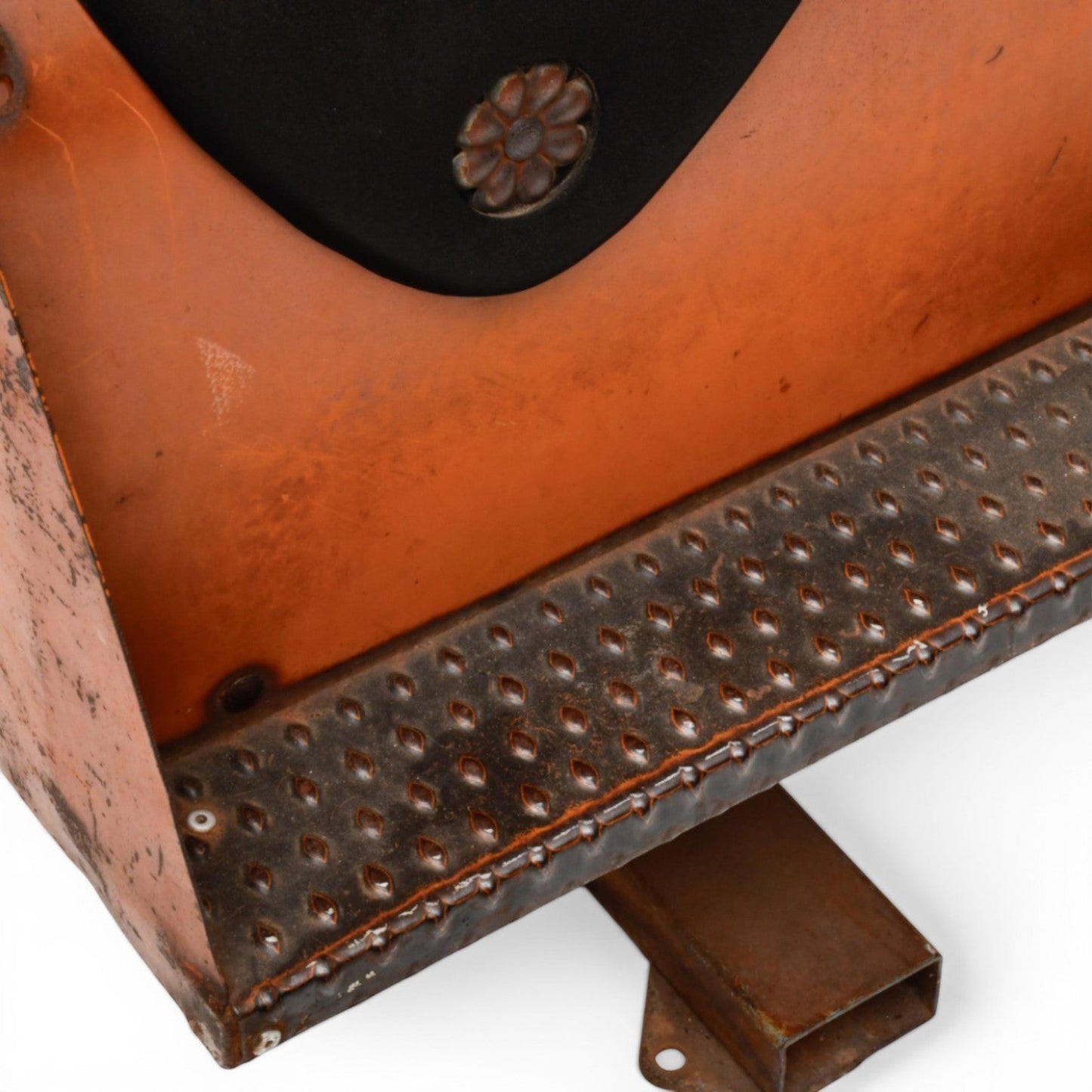 La Basilica Galeria antique industrial four-seat horse rocker with orange patina, black padded seats, and diamond plate footrests.