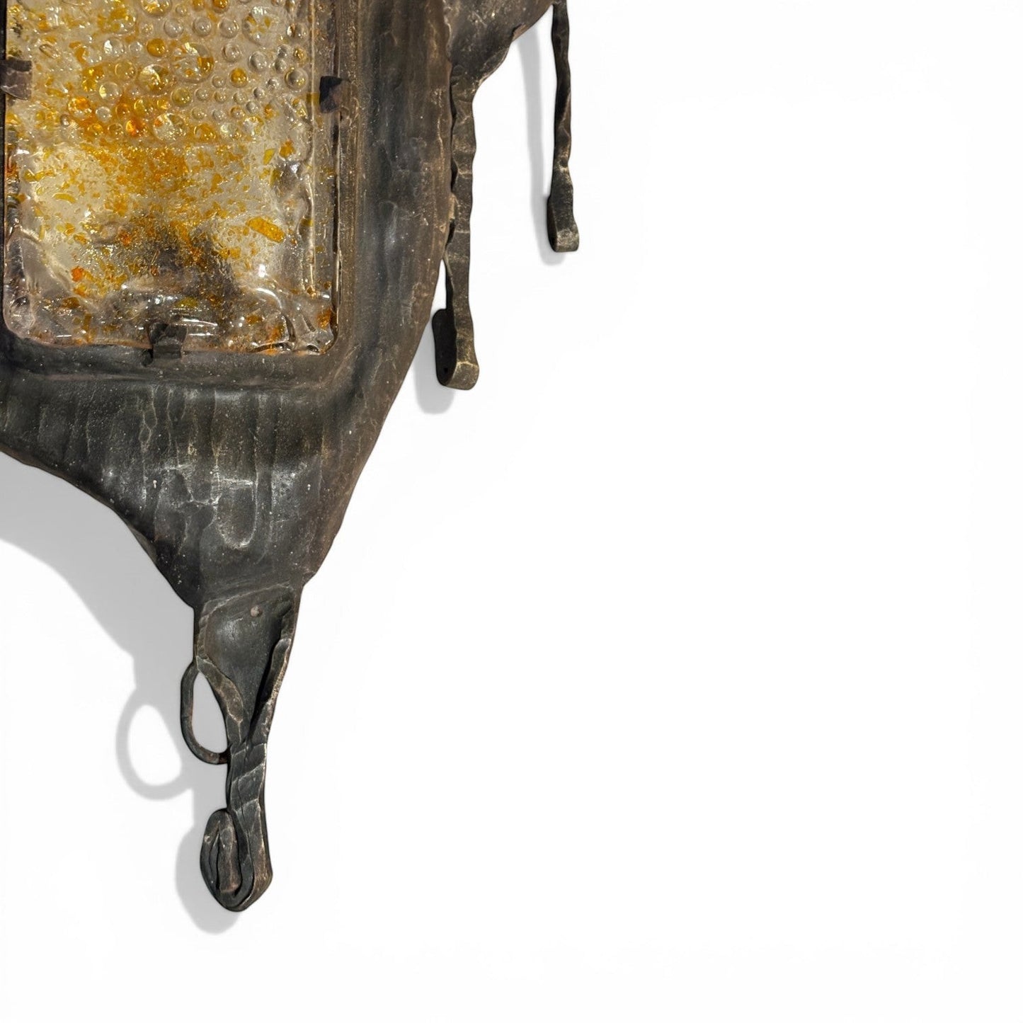 La Basilica Galeria Brutalist amber bubble glass wall sconce with oxidized metal frame and torch-cut details.