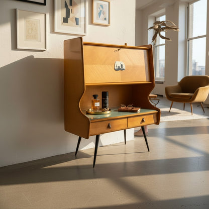 La Basilica Galeria Mid-Century Italian bureau sideboard in honey wood veneer with curved wings, smoke-grey glass top, and tapered legs.