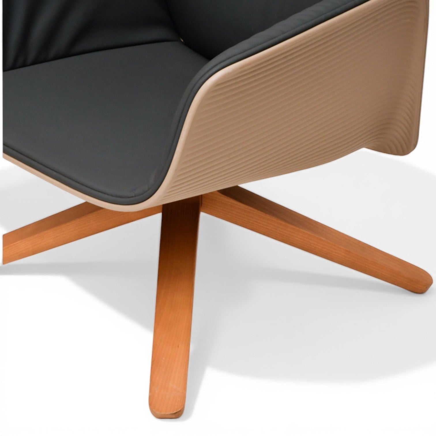 La Basilica Galeria Nuez Lounge Chair by Patricia Urquiola, sand thermoplastic shell, charcoal leather interior, oak swivel base.