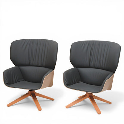 La Basilica Galeria pair of Nuez Lounge Chairs by Patricia Urquiola, sand thermoplastic shell, charcoal leather interior, oak swivel base.
