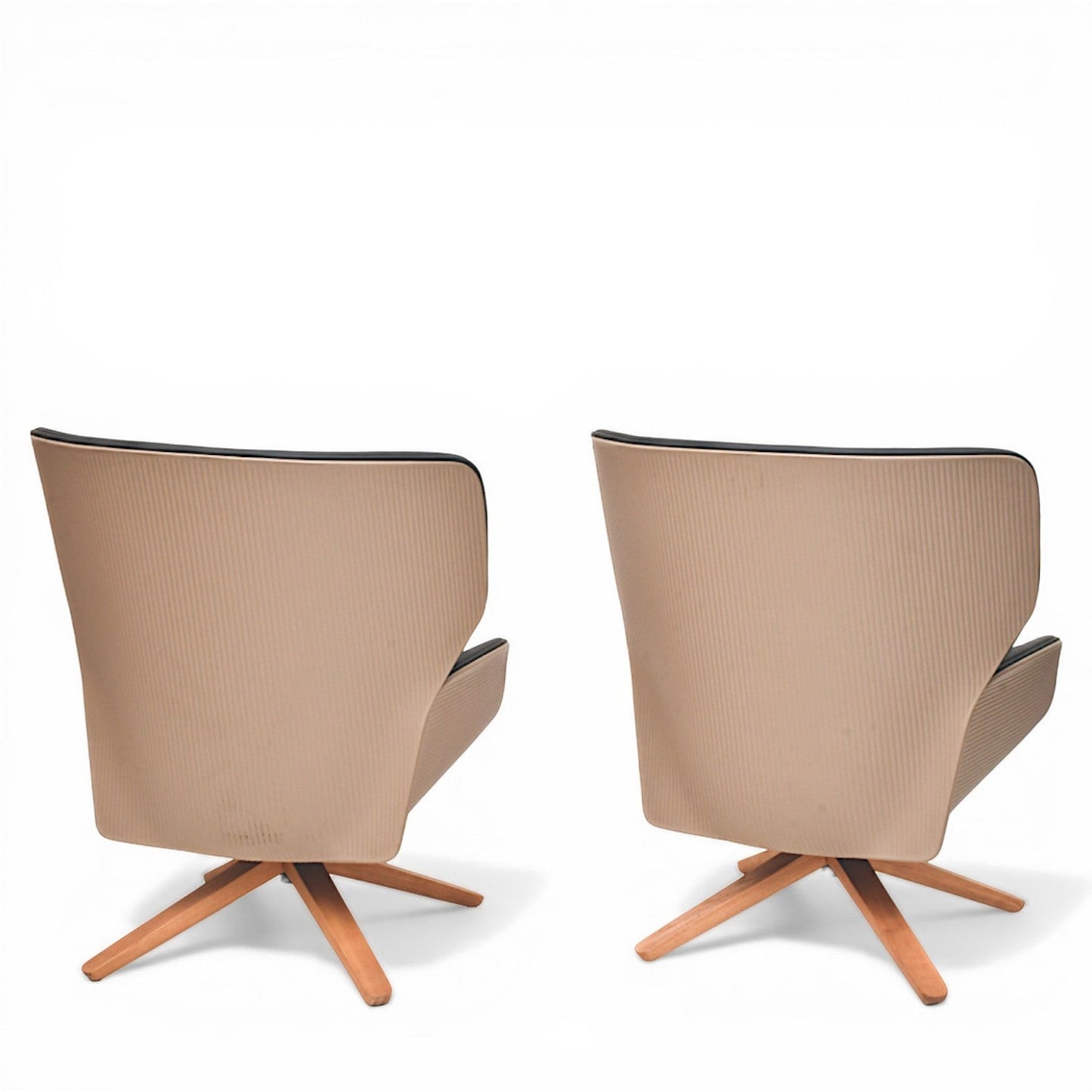 La Basilica Galeria pair of Nuez Lounge Chairs by Patricia Urquiola in sand-colored thermoplastic with oak swivel base.