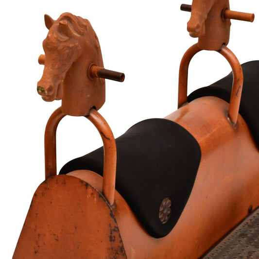 La Basilica Galeria antique industrial four-seat horse rocker with orange patina, black padded seats, and cast metal horse heads.