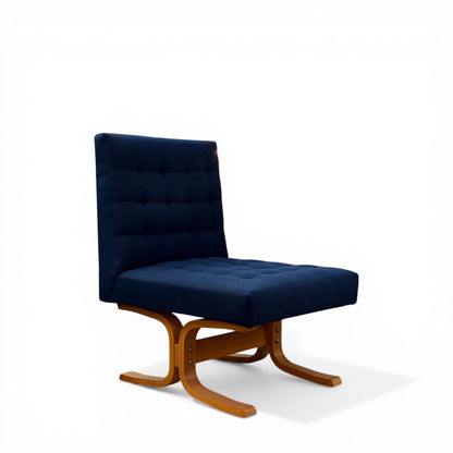 Mid-Century bentwood lounge chair by Ludvik Volak upholstered in blue tufted fabric front view
